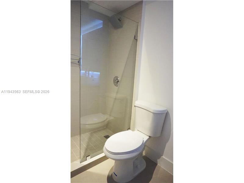100 Lincoln Road, Unit 420 Miami Beach, FL 33139 - Photo 19 of 25 a bathroom with a toilet and a shower