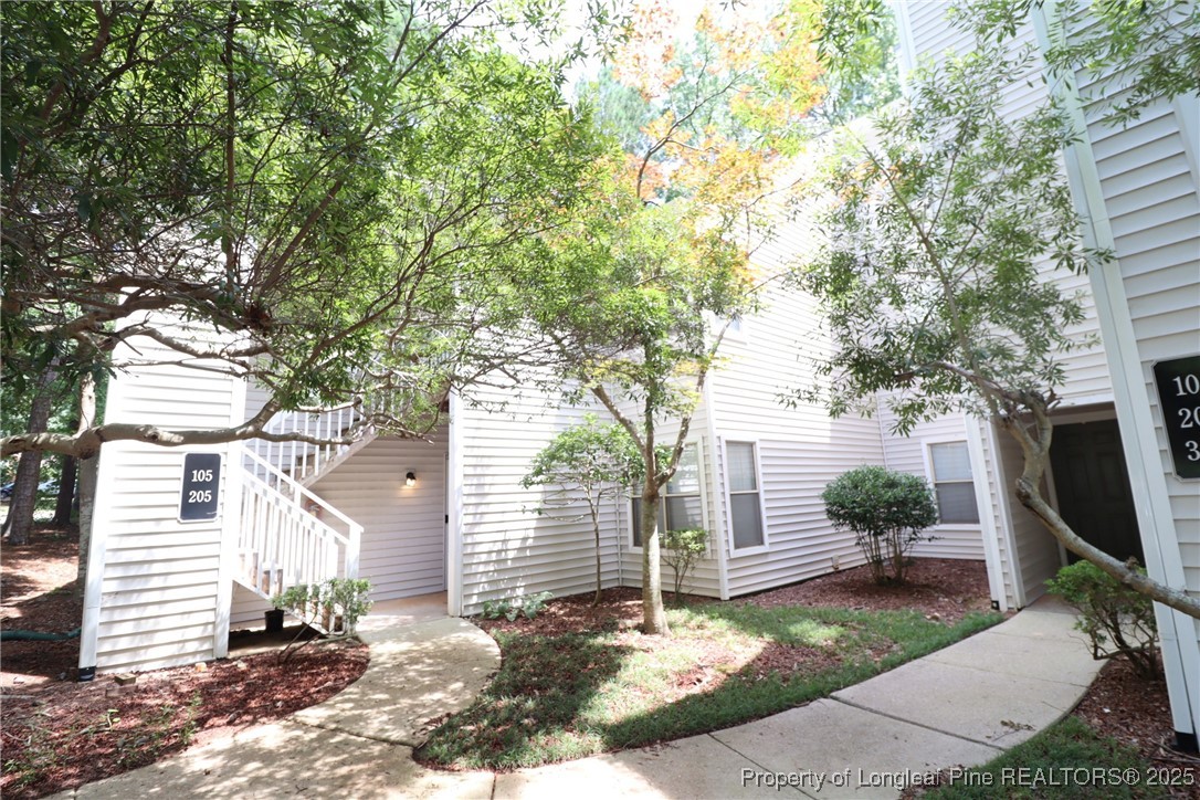 6120 Sunpointe Drive, Unit 205 Raleigh, NC 27606 - Photo 1 of 32 a view of a backyard with a patio