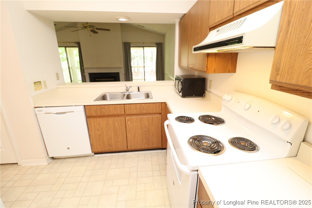 6120 Sunpointe Drive, Unit 205 Raleigh, NC 27606 - Photo 11 of 32 a bathroom with a sink and a mirror