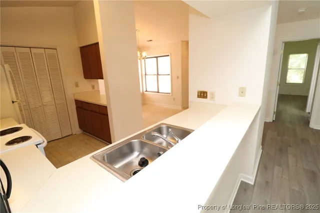 a view of kitchen with furniture and flat screen tv