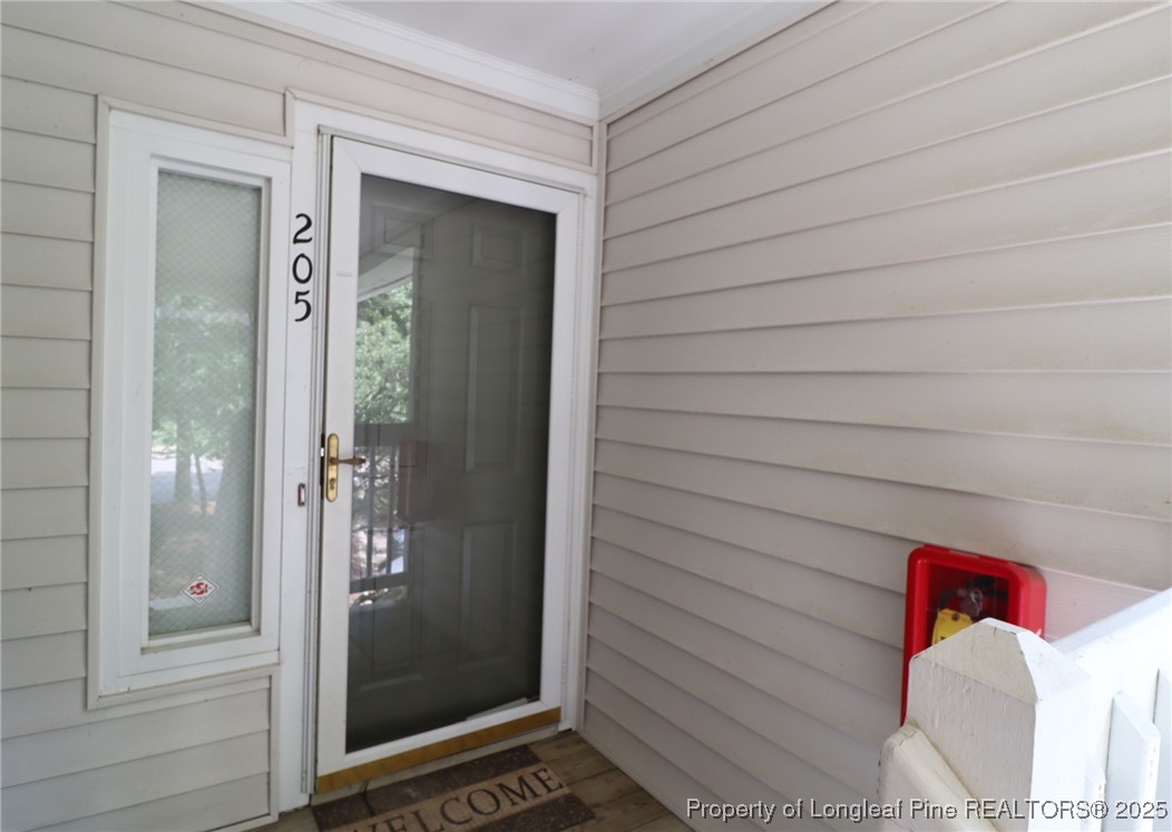 6120 Sunpointe Drive, Unit 205 Raleigh, NC 27606 - Photo 2 of 32 a view of an entryway