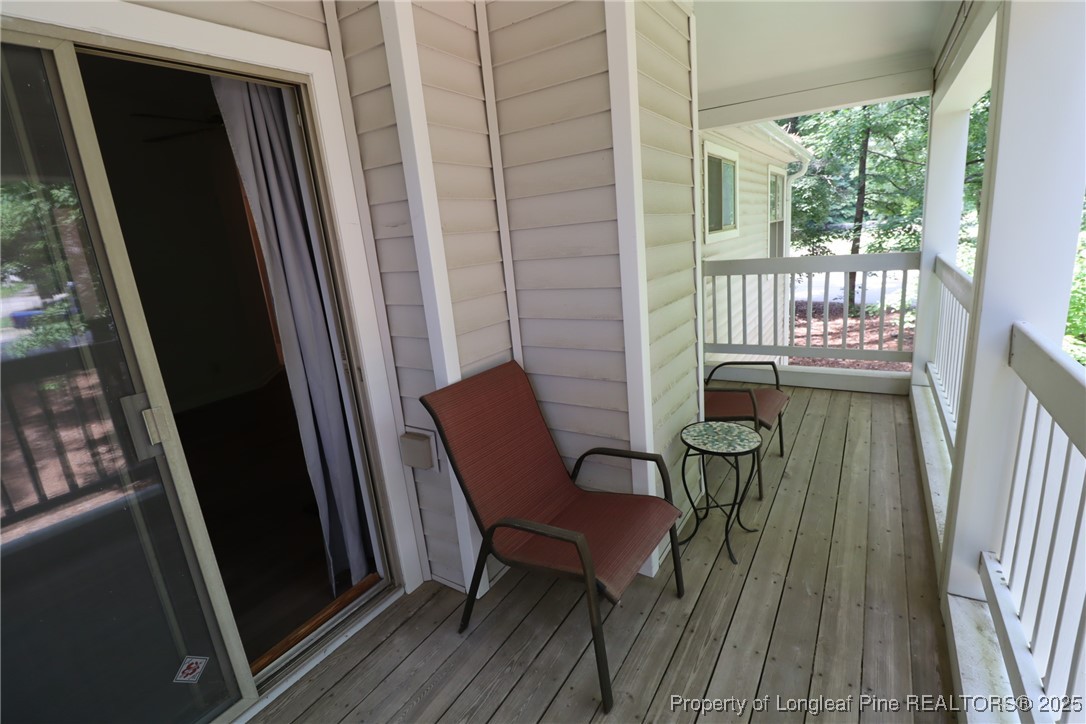 6120 Sunpointe Drive, Unit 205 Raleigh, NC 27606 - Photo 30 of 32 a view of a chair in a balcony