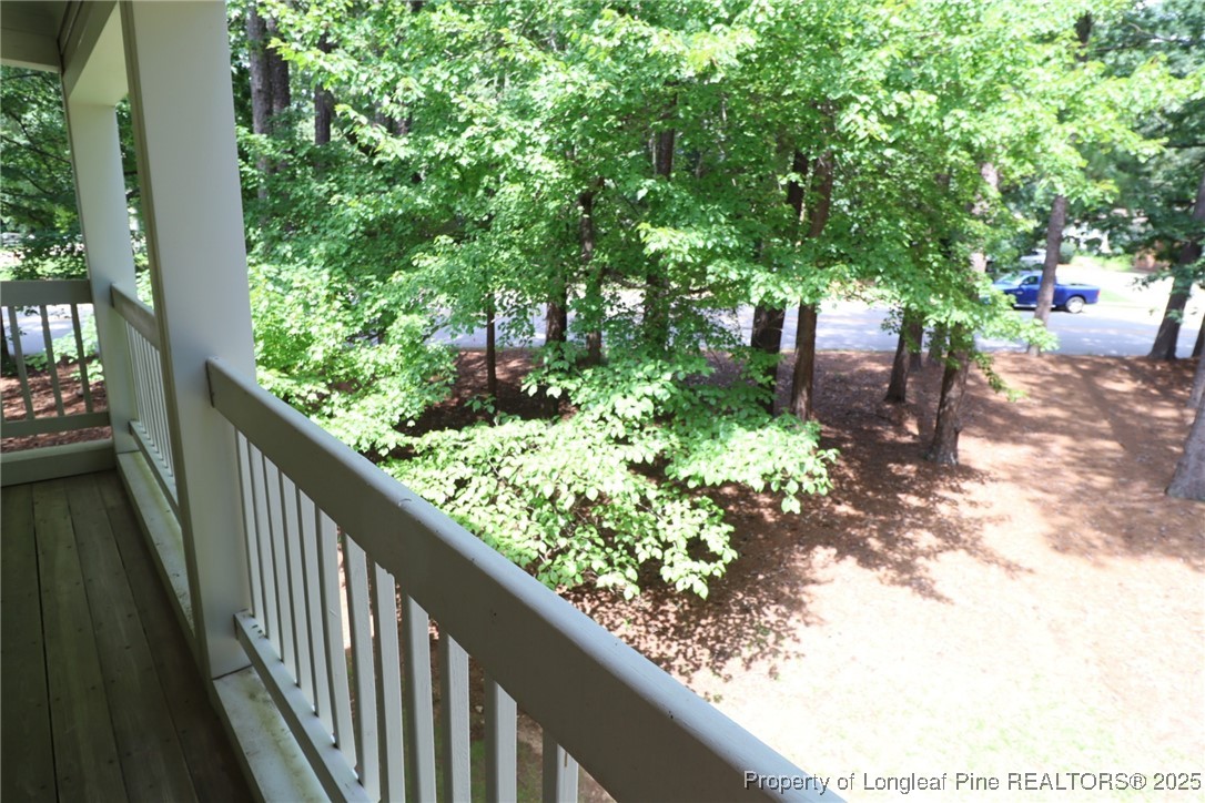 6120 Sunpointe Drive, Unit 205 Raleigh, NC 27606 - Photo 31 of 32 a view of balcony and trees