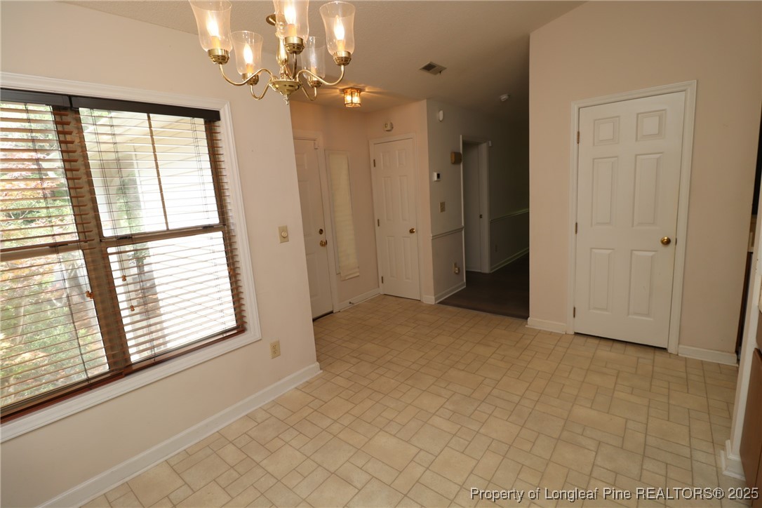 6120 Sunpointe Drive, Unit 205 Raleigh, NC 27606 - Photo 6 of 32 a view of an empty room with a window
