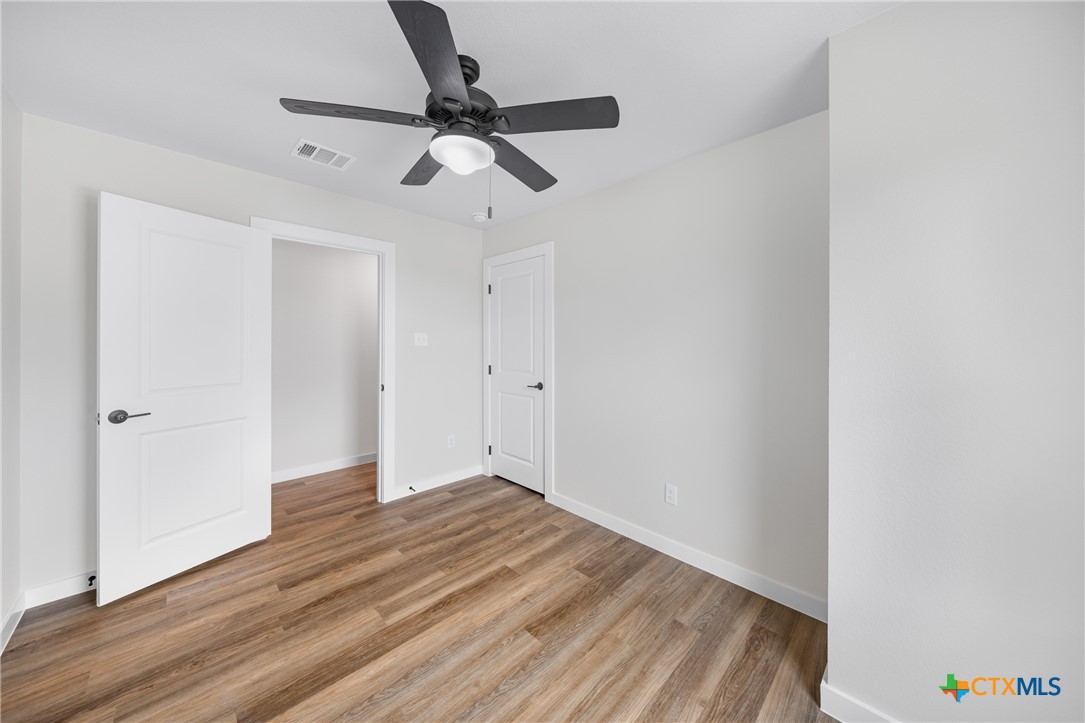 709 South 28th Street, Unit A Temple, TX 76501 - Photo 20 of 26 a view of empty room with wooden floor