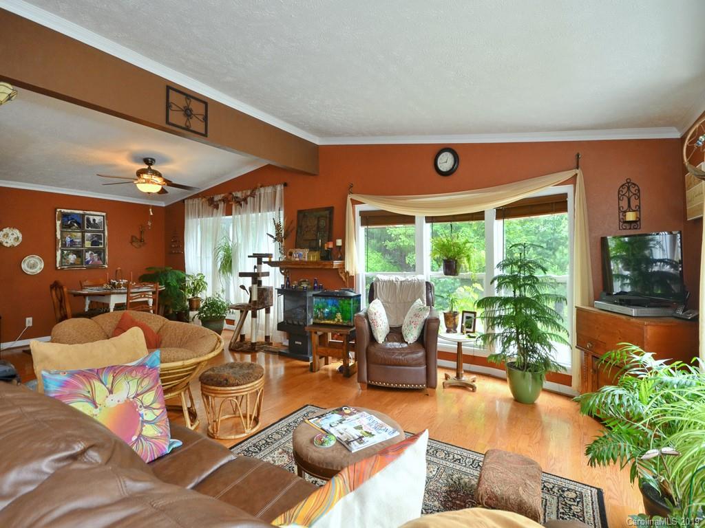 613 Turkey Creek Road Clyde, NC 28721 - Photo 3 of 18 a living room with furniture and a large window