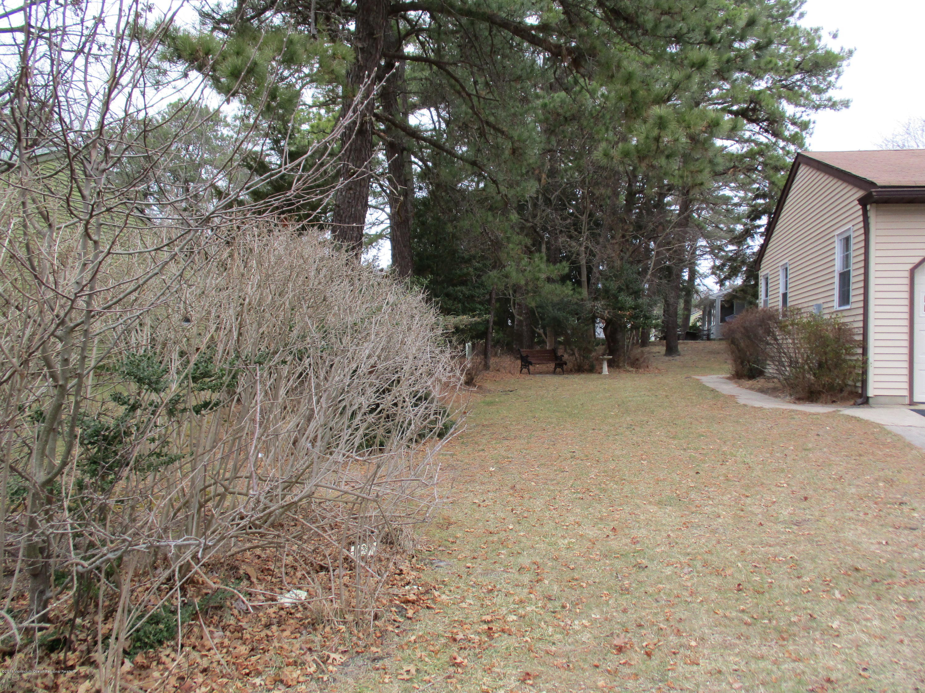 85 Sunset Road, Unit 60 Whiting, NJ 08759 - Photo 14 of 18 a view of a yard covered with snow in front of house