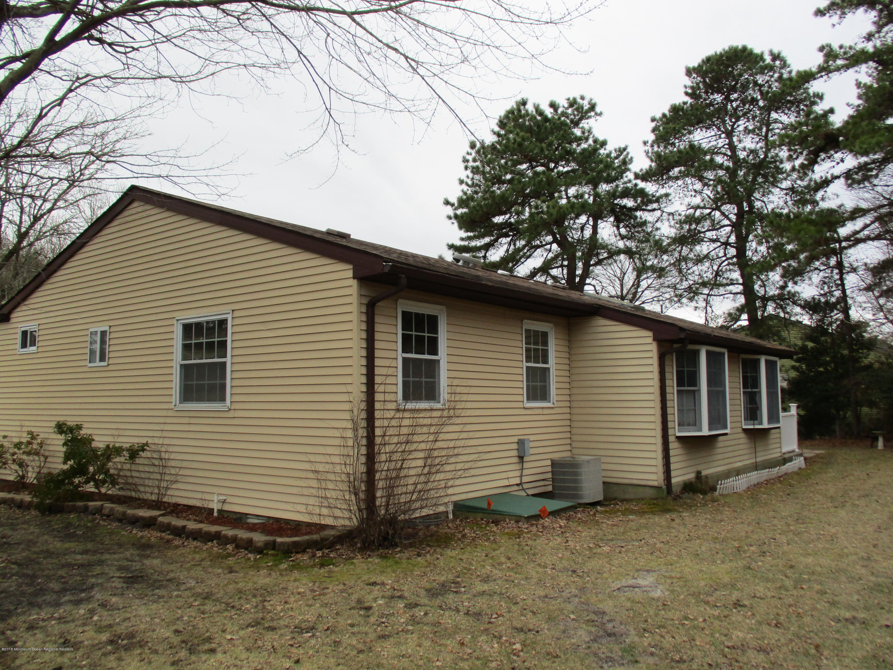 85 Sunset Road, Unit 60 Whiting, NJ 08759 - Photo 16 of 18 a view of a house with a yard