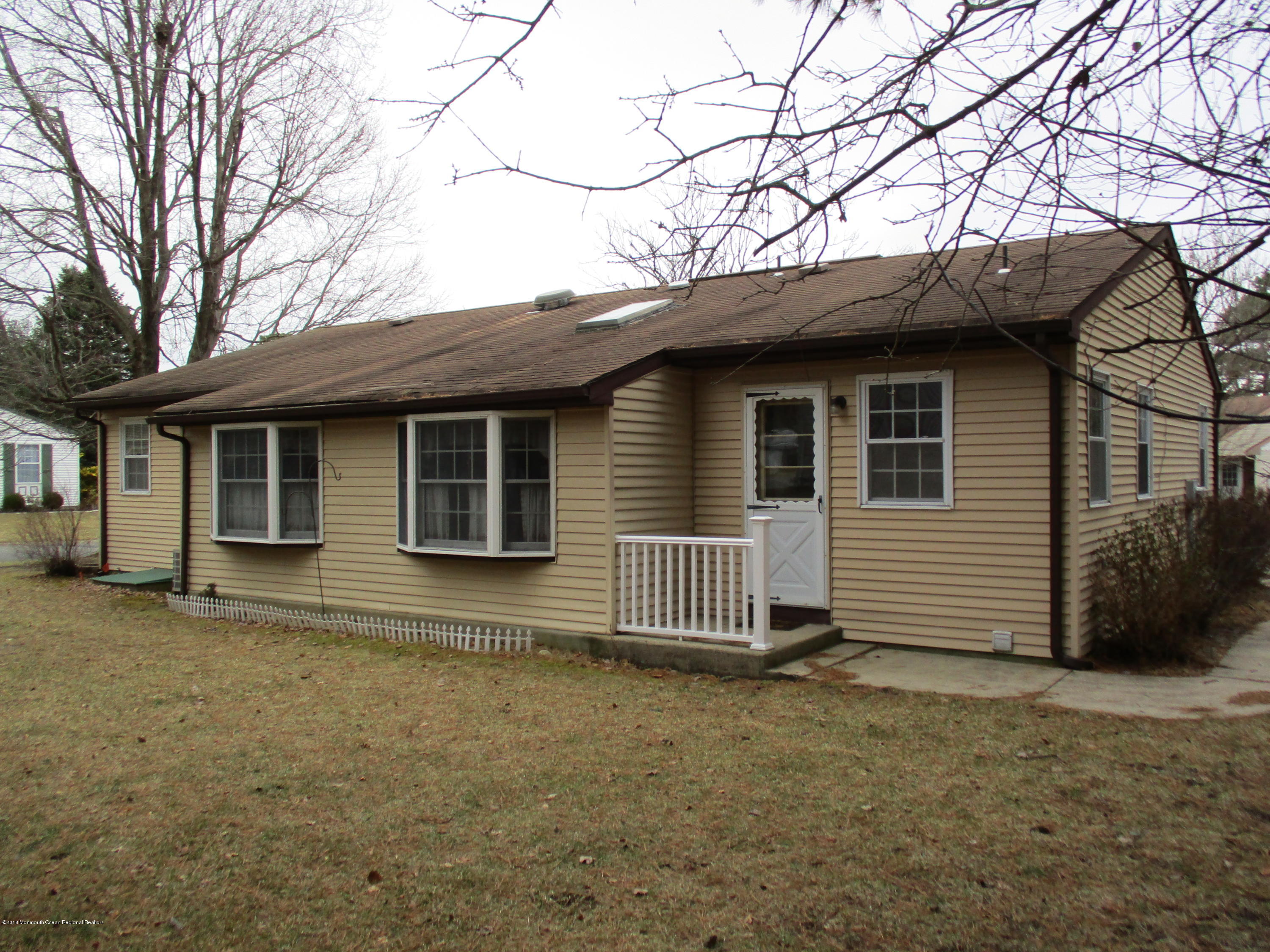 85 Sunset Road, Unit 60 Whiting, NJ 08759 - Photo 17 of 18 a view of a house with a yard