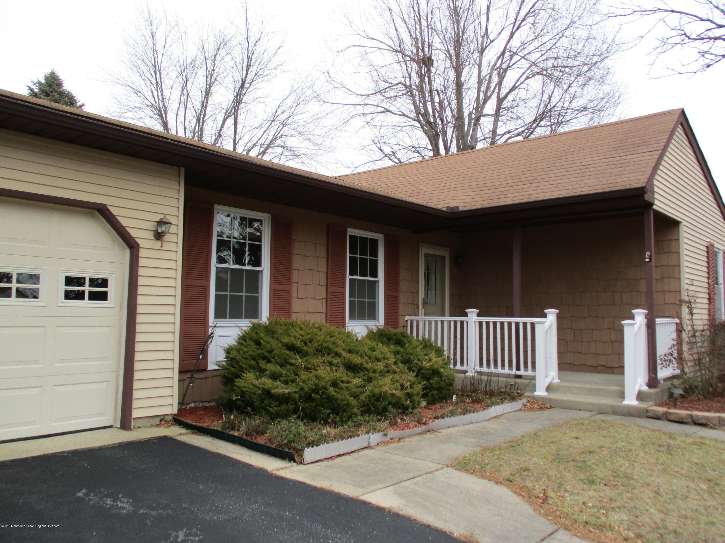85 Sunset Road, Unit 60 Whiting, NJ 08759 - Photo 18 of 18 a front view of a house with a yard