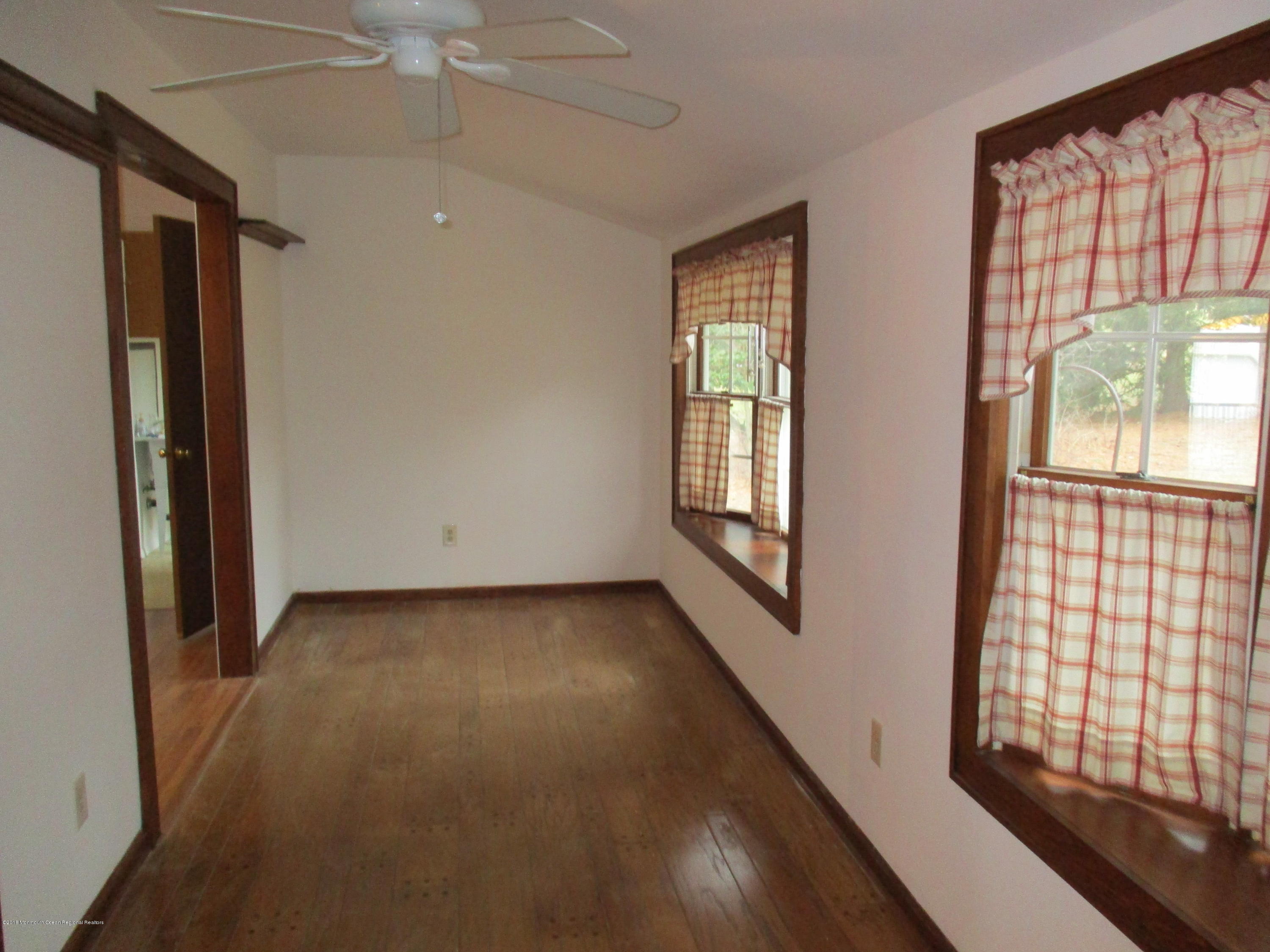 85 Sunset Road, Unit 60 Whiting, NJ 08759 - Photo 3 of 18 an empty room with windows