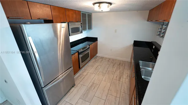 a view of a hallway with washer and dryer