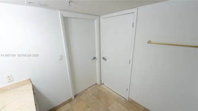 a view of a storage & utility room with a sink