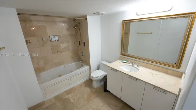 a kitchen with stainless steel appliances a refrigerator and a stove