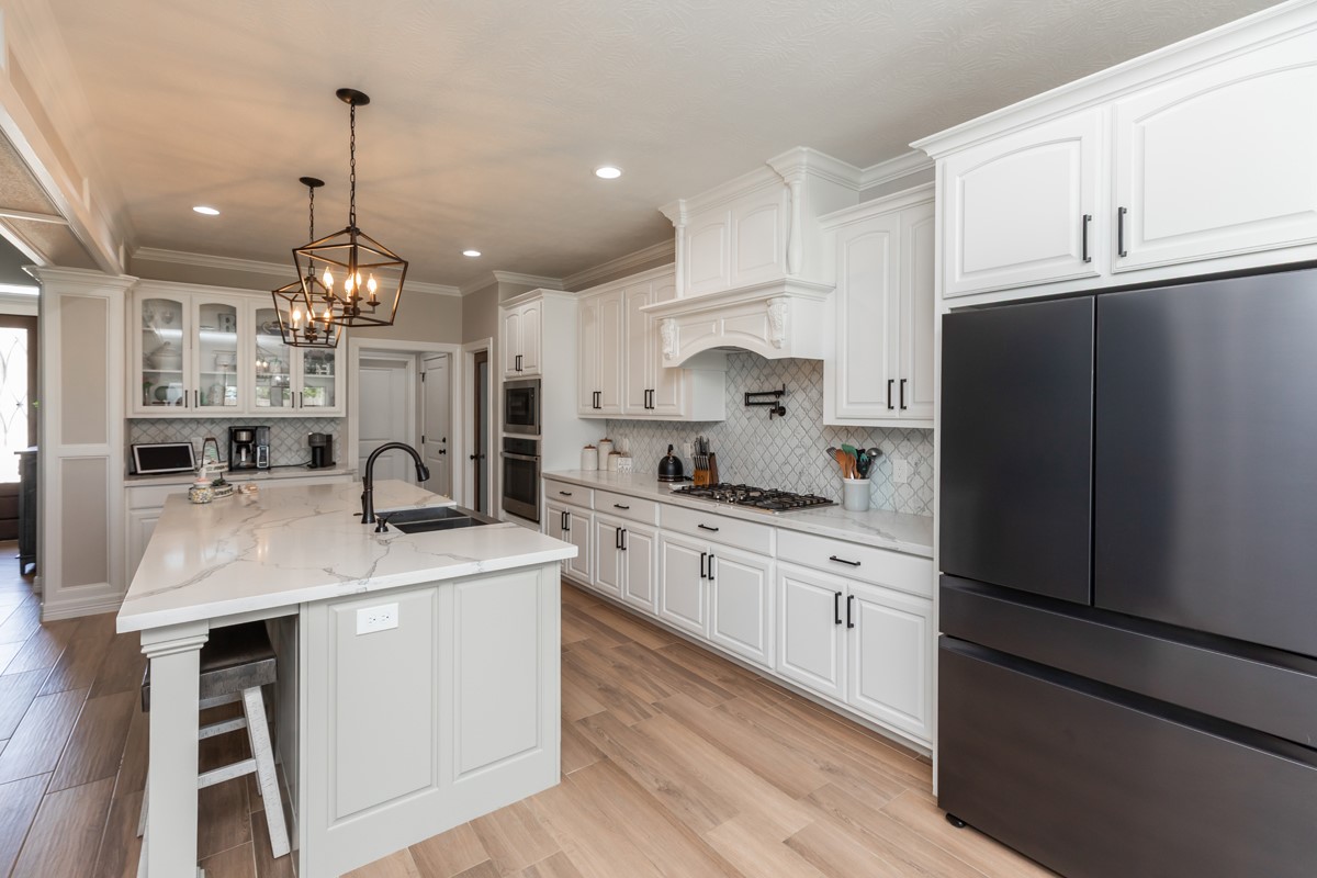 1880 Brenner Boulevard Lumberton, TX 77657 - Photo 11 of 32 a kitchen with kitchen island a sink stove and refrigerator