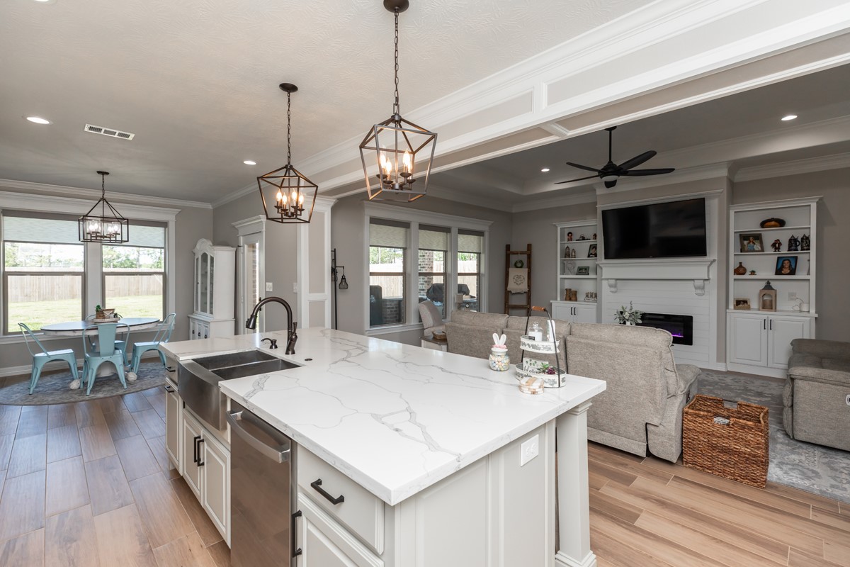 1880 Brenner Boulevard Lumberton, TX 77657 - Photo 12 of 32 a kitchen with stainless steel appliances granite countertop a sink a stove and a wooden floor