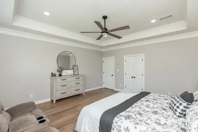 a bedroom with a bed and a dresser