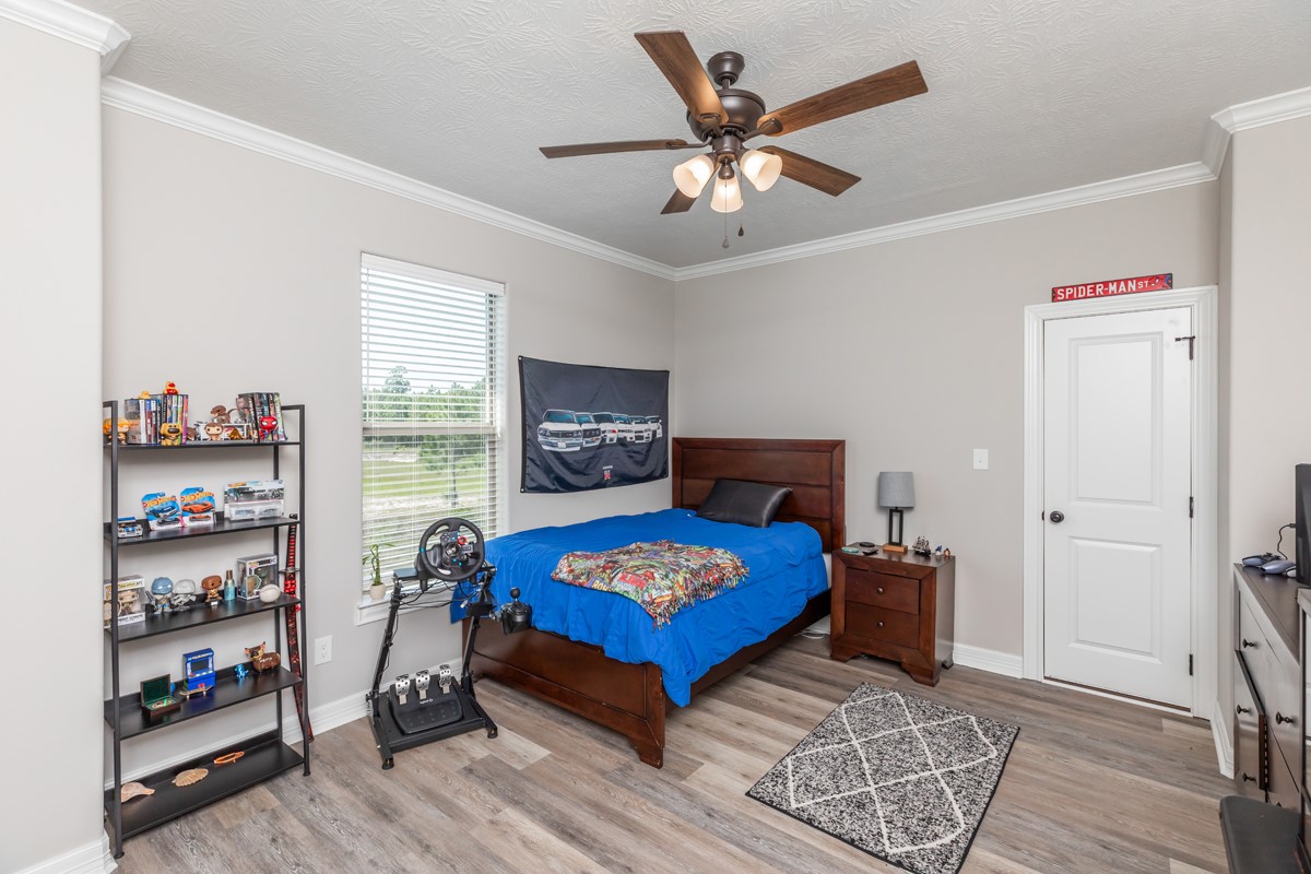1880 Brenner Boulevard Lumberton, TX 77657 - Photo 23 of 32 a living room with furniture and a flat screen tv