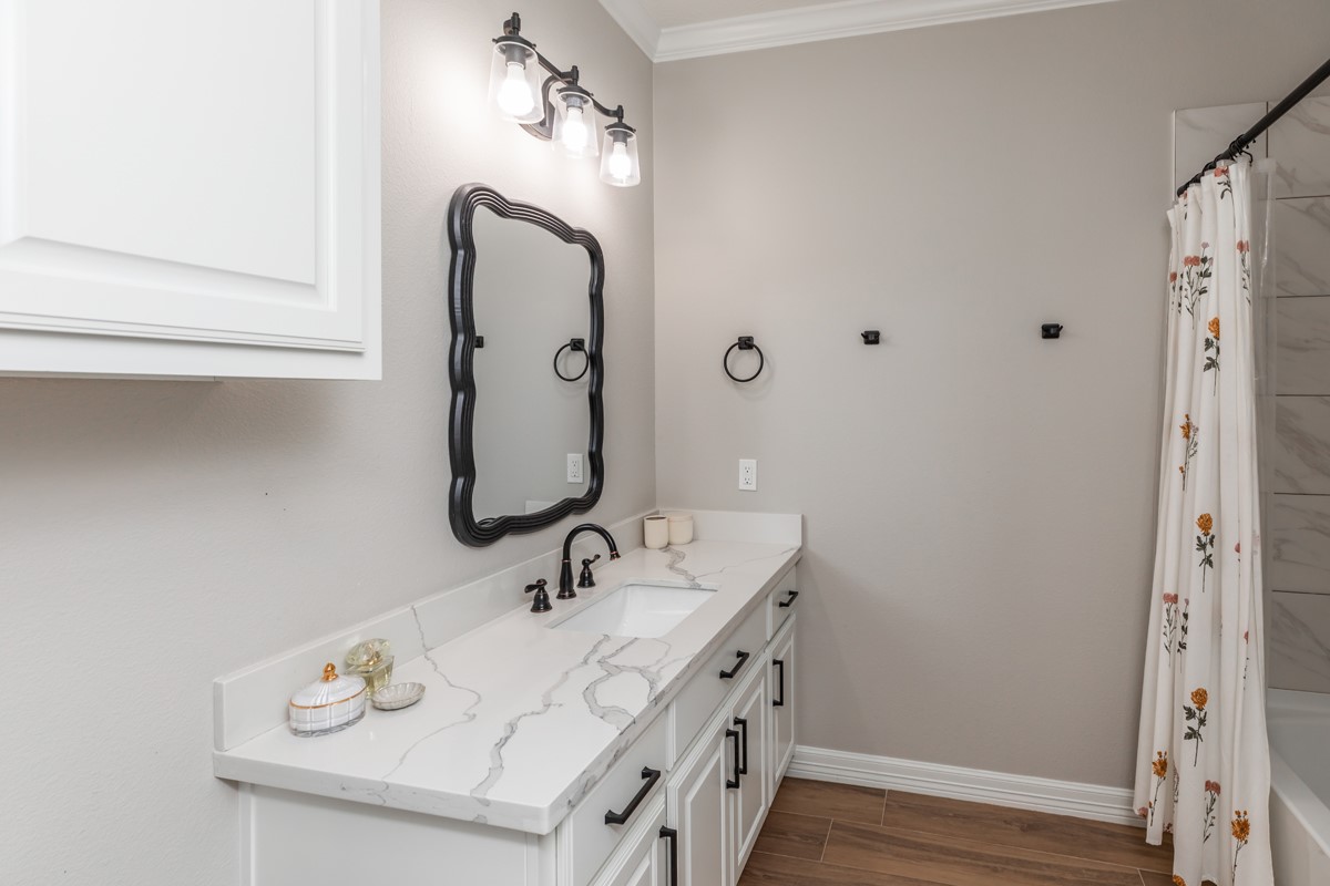 1880 Brenner Boulevard Lumberton, TX 77657 - Photo 26 of 32 a bathroom with a sink and a mirror