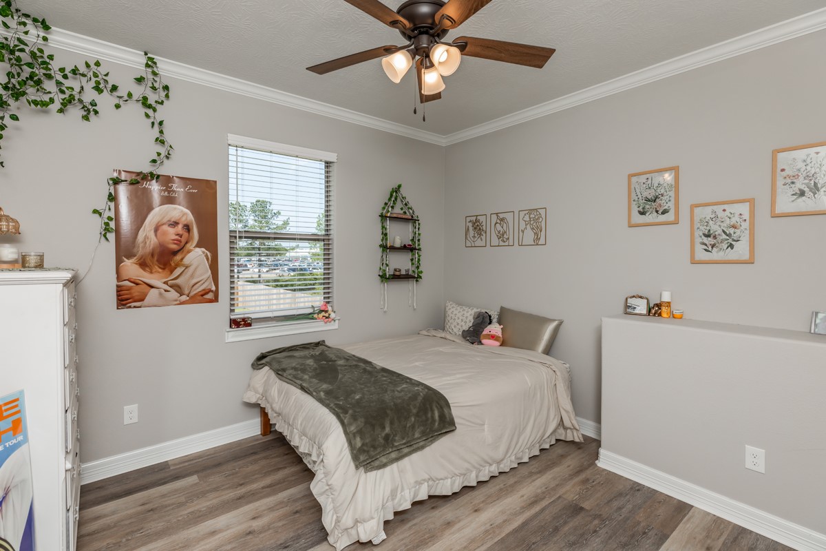 1880 Brenner Boulevard Lumberton, TX 77657 - Photo 27 of 32 a bedroom with a bed and a window