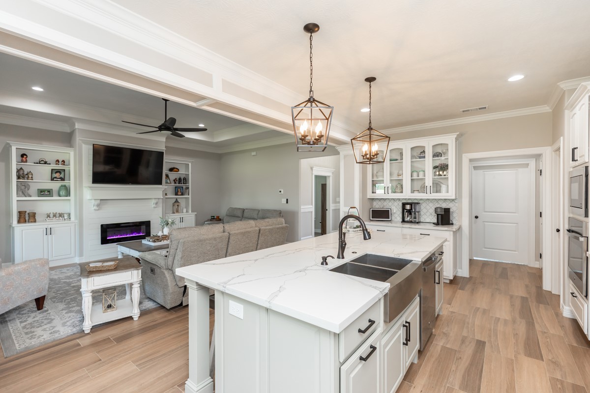 1880 Brenner Boulevard Lumberton, TX 77657 - Photo 10 of 32 a kitchen with a sink a stove and chairs