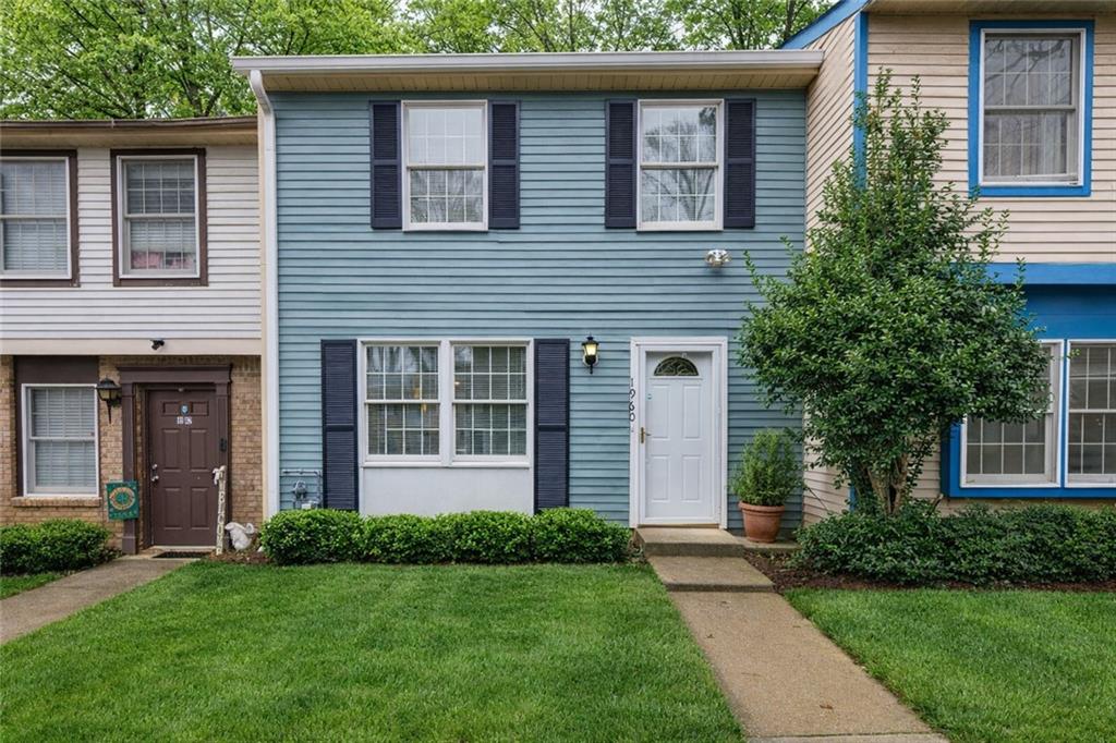 1960 Hamilton Place Southeast Marietta, GA 30067 - Photo 1 of 22 front view of a house and a yard