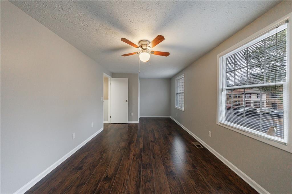 1960 Hamilton Place Southeast Marietta, GA 30067 - Photo 16 of 22 a view of an empty room with window and wooden floor