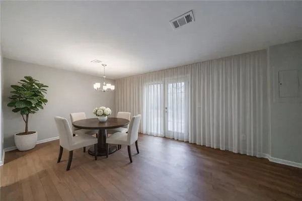 a view of a dining room with furniture and window