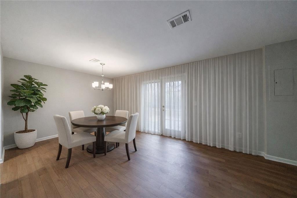 1960 Hamilton Place Southeast Marietta, GA 30067 - Photo 4 of 22 a view of a dining room with furniture and window