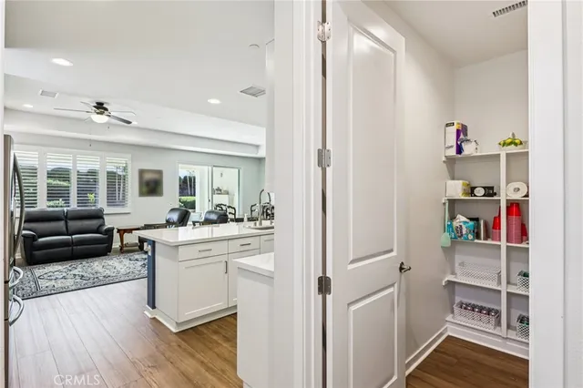 a view of kitchen with sink and wooden floor