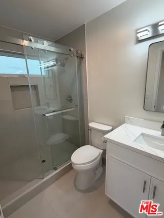 a kitchen with stainless steel appliances a refrigerator sink and microwave