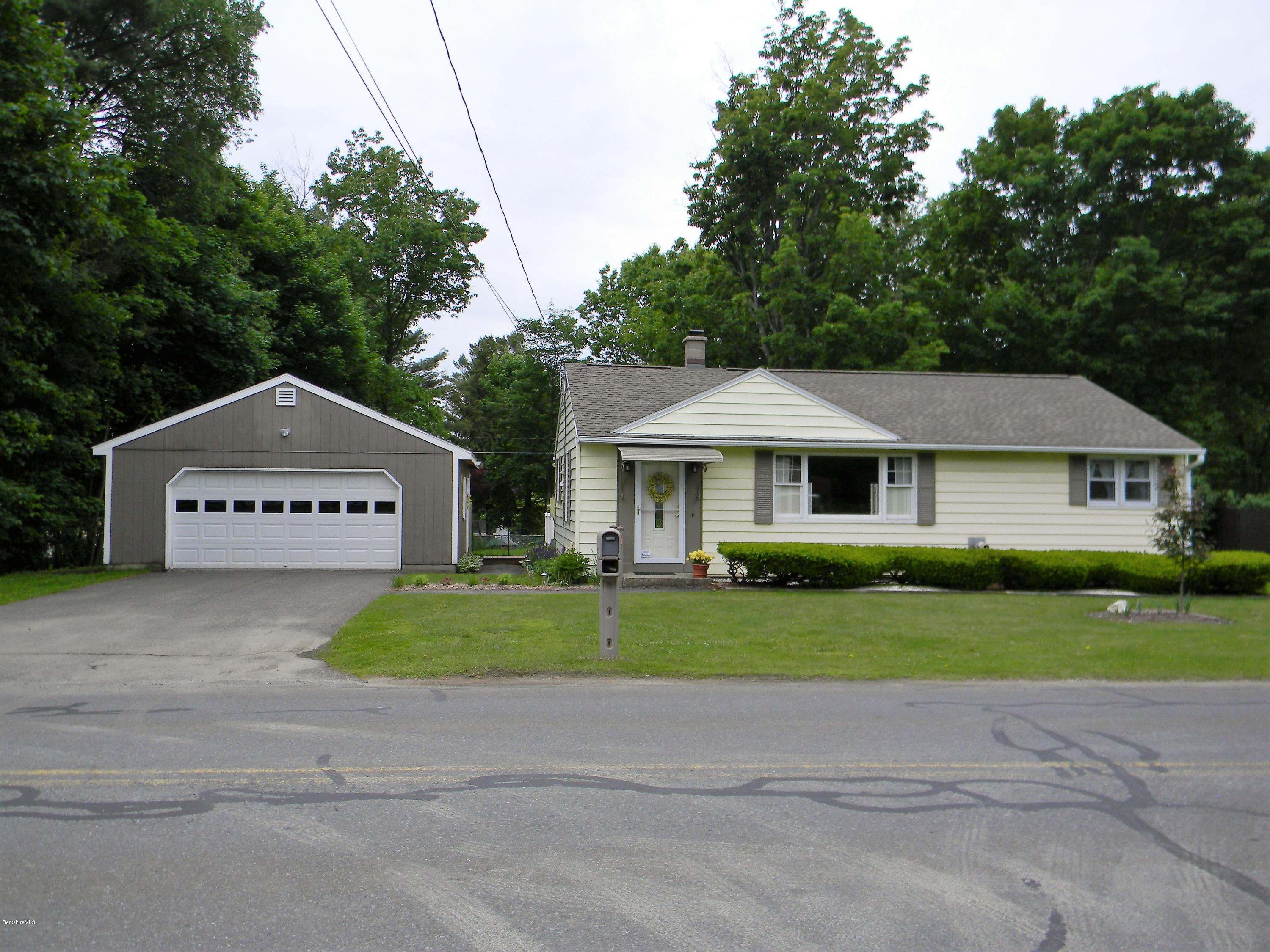 9 Balance Rock Road Lanesborough, MA 01237 - Photo 2 of 20 a front view of a house with a yard and garage