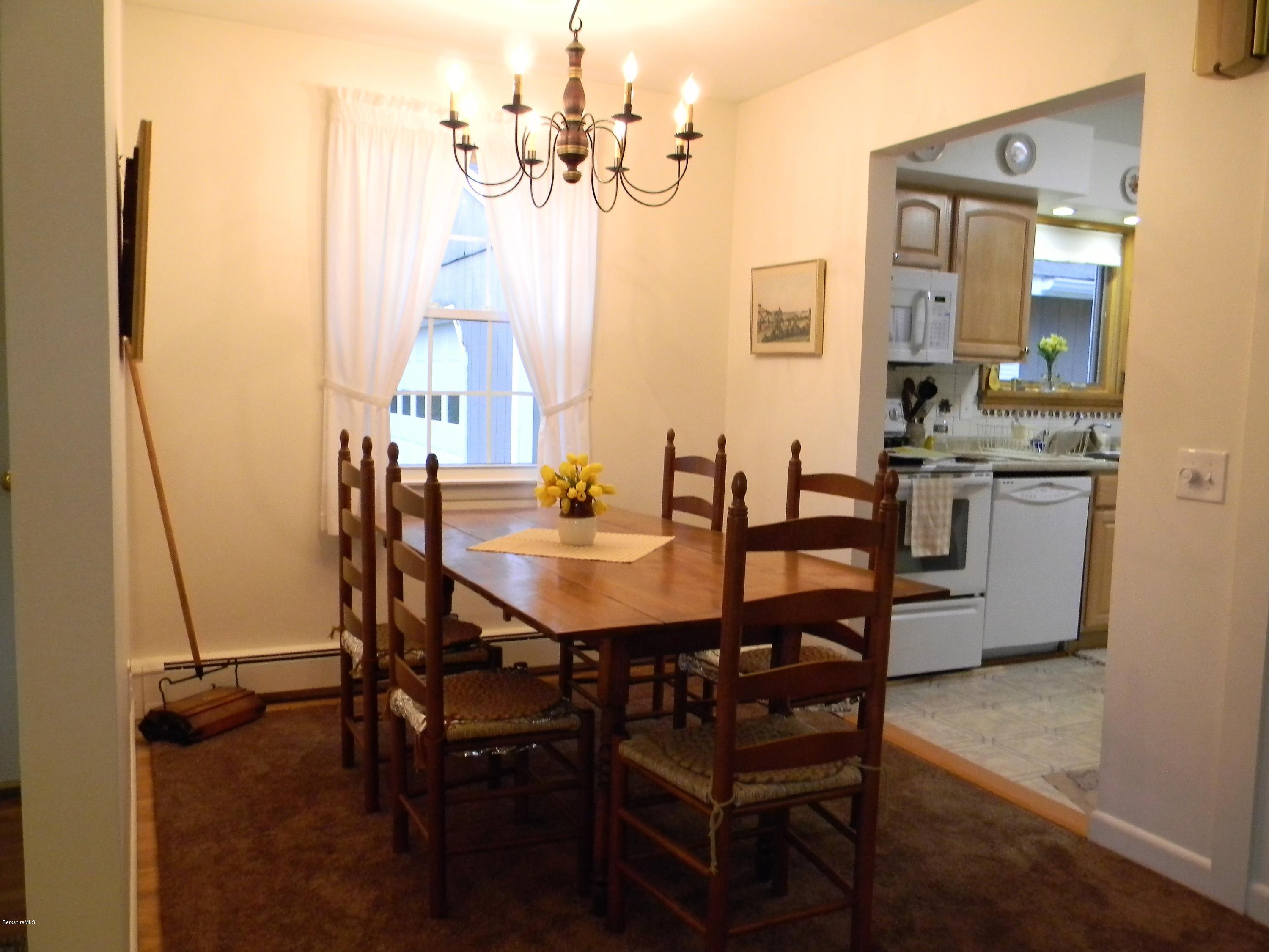 9 Balance Rock Road Lanesborough, MA 01237 - Photo 9 of 20 a view of a dining room with furniture and a chandelier