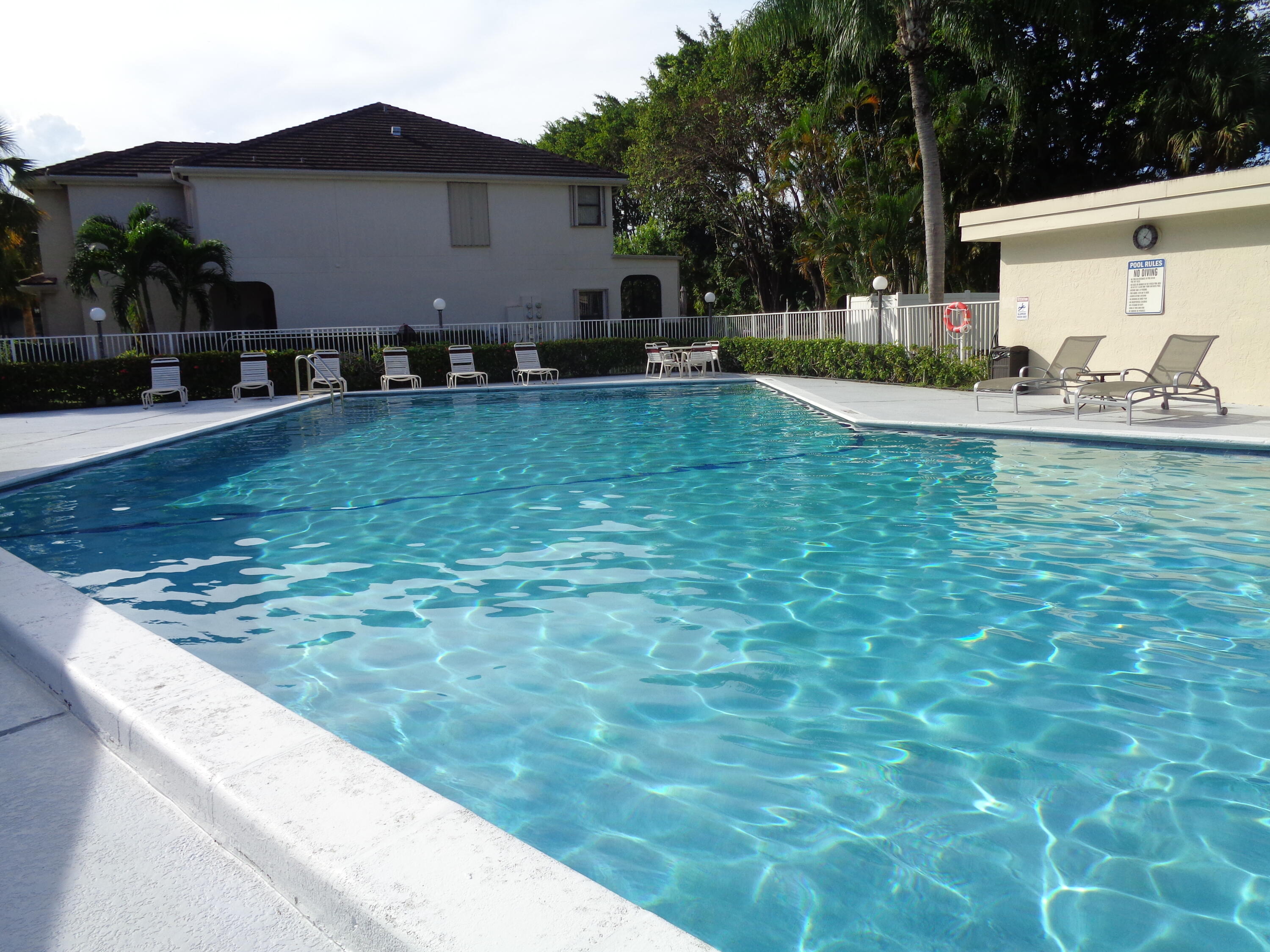 6328 Longboat Lane West, Unit 201 Boca Raton, FL 33433 - Photo 15 of 16 a backyard of a house with lots of green space