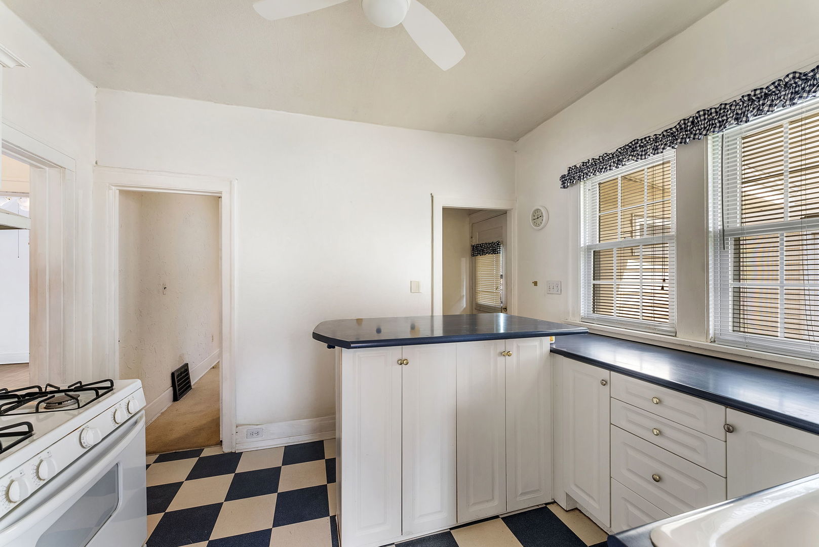 1904 30th Street Moline, IL 61265 - Photo 8 of 13 a kitchen with granite countertop cabinets and window
