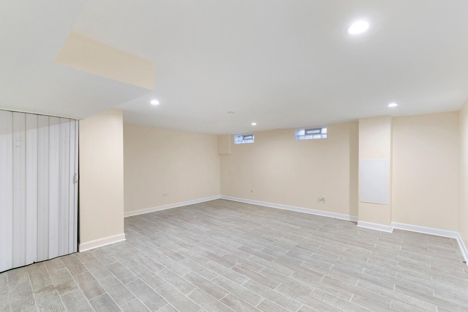 1731 East 74th Street Chicago, IL 60649 - Photo 15 of 19 an empty room with wooden floor and windows