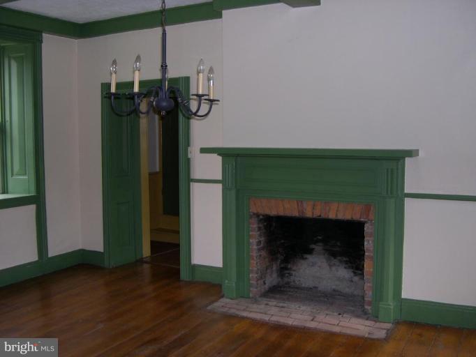 13726 New Windsor Road Union Bridge, MD 21791 - Photo 3 of 10 a living room with furniture and a fireplace
