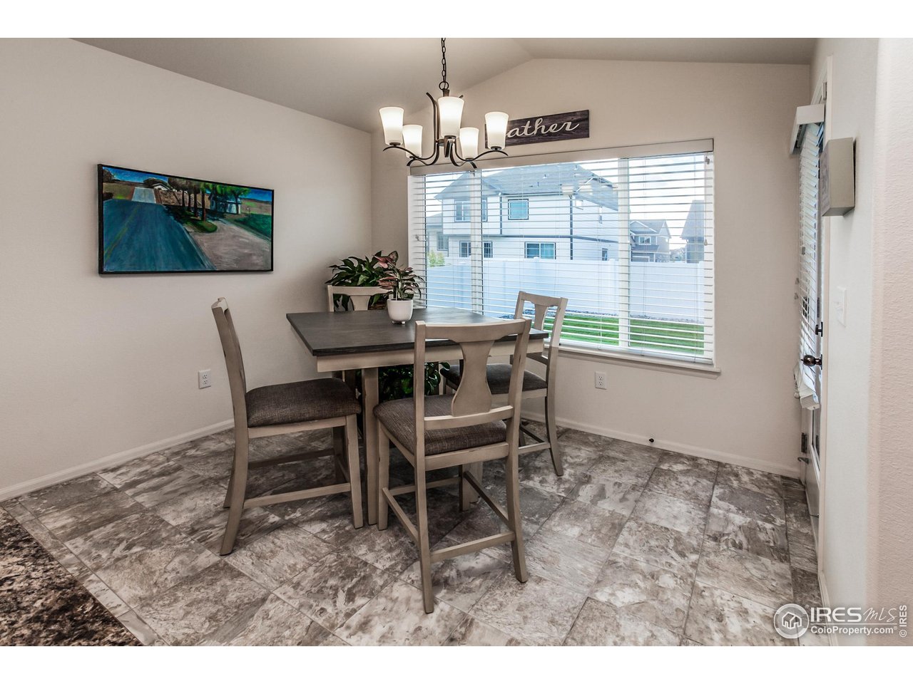 944 Maplebrook Drive Windsor, CO 80550 - Photo 10 of 32 a dining room with furniture and window