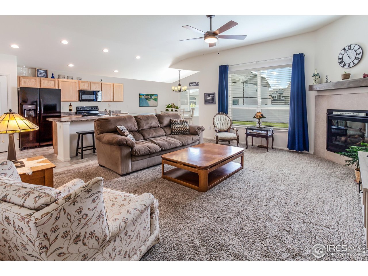 944 Maplebrook Drive Windsor, CO 80550 - Photo 6 of 32 a living room with furniture and a fireplace