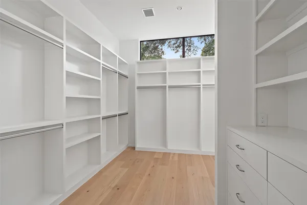 a view of an empty walk in closet