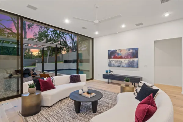 a living room with furniture and a large window