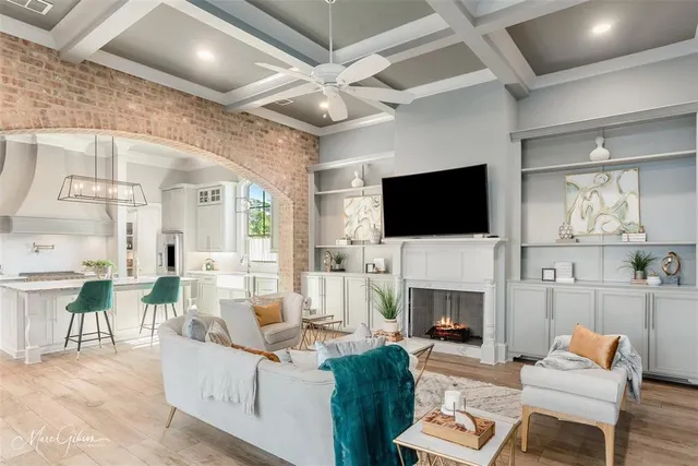 a living room with fireplace furniture and a flat screen tv