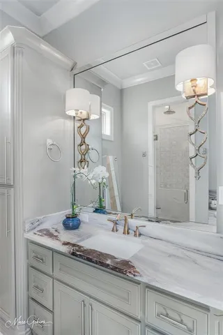 a bathroom with a tub sink and mirror