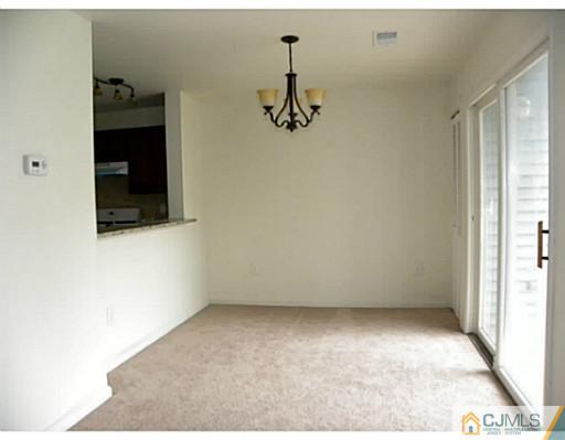 821 Edpas Road New Brunswick, NJ 08901 - Photo 8 of 12 a view of a room with wooden floor and windows
