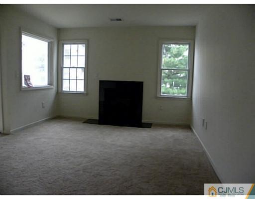 821 Edpas Road New Brunswick, NJ 08901 - Photo 9 of 12 an empty room with windows