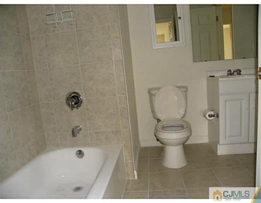 821 Edpas Road New Brunswick, NJ 08901 - Photo 10 of 12 a bathroom with a toilet and a shower