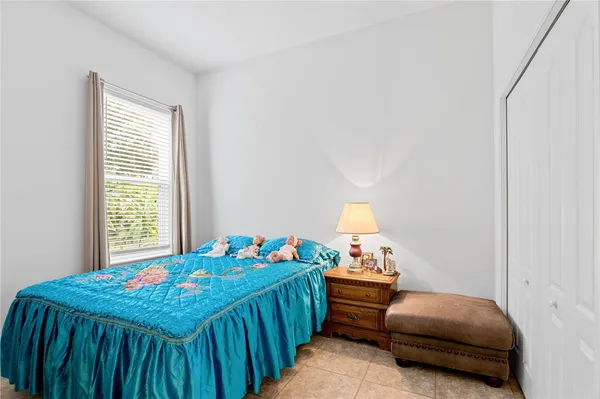 a bedroom with a bed and a table