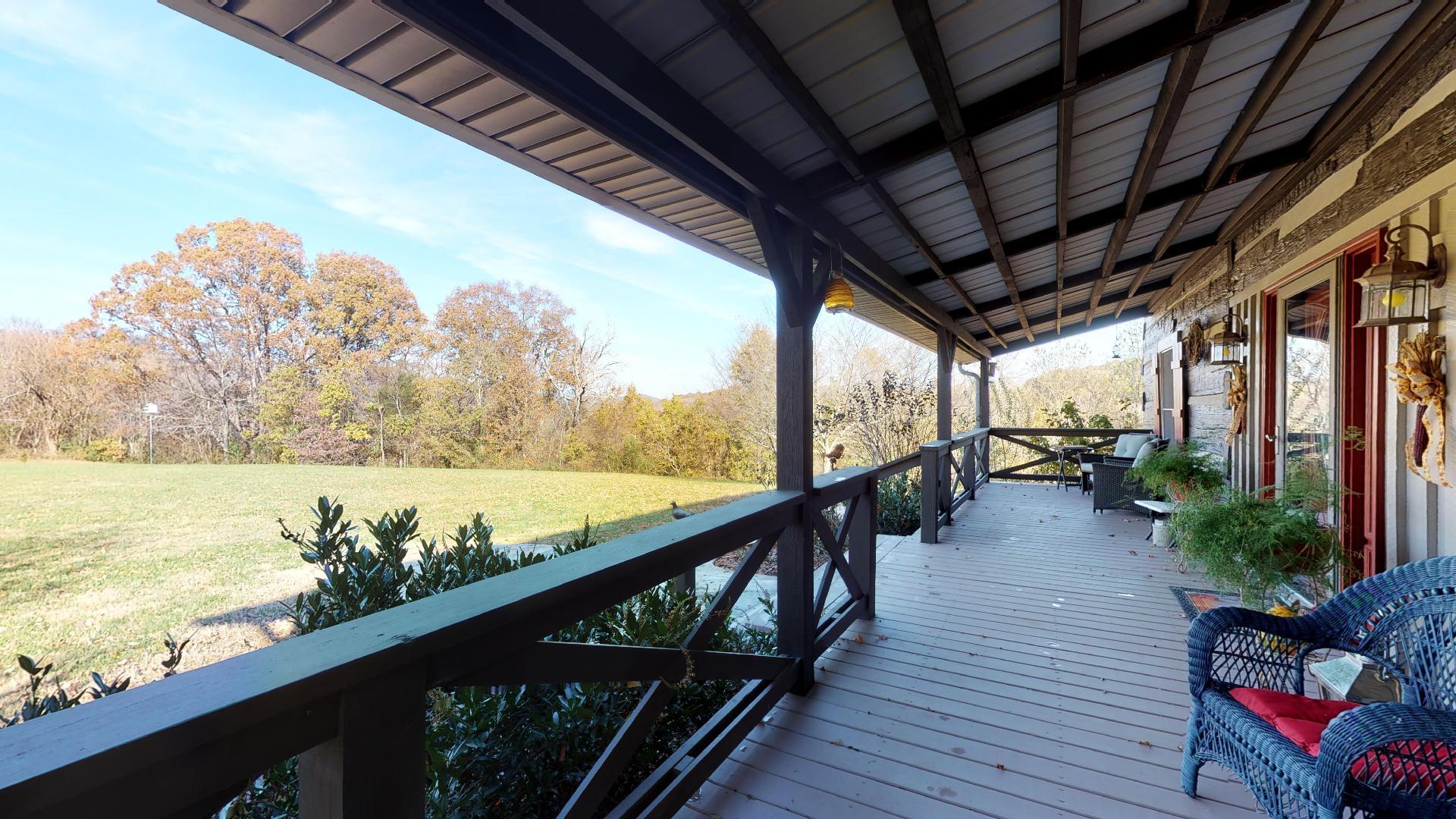 2281 Osburn Road Arrington, TN 37014 - Photo 7 of 29 a view of a balcony with wooden floor and outdoor space