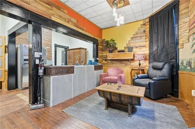 a living room with furniture a fireplace and a table