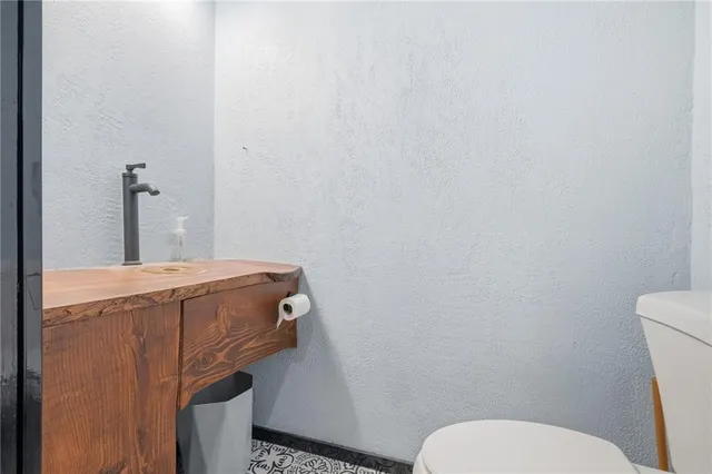 a bathroom with a toilet and a sink